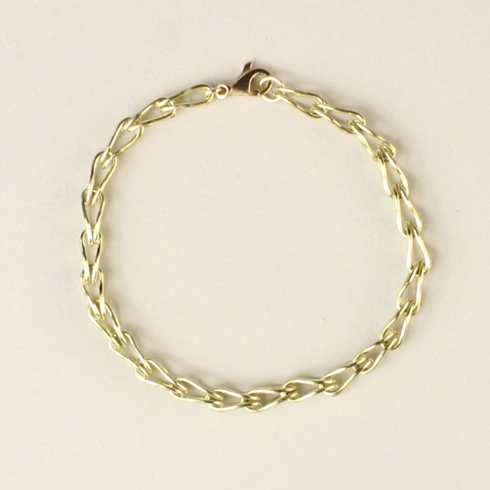 14 karaat gouden schakelarmband vossenstaart, handgemaakt door goudsmid / Edelsmid Monique Zonneveld. Liggend op een witte achtergrond.